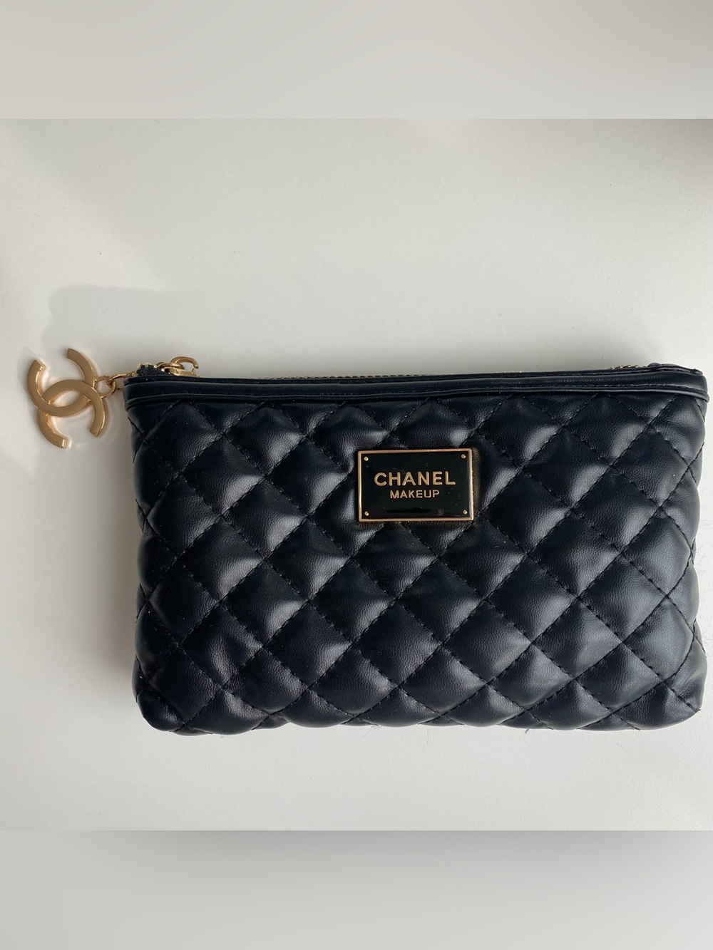CHANEL Black Quilted Cosmetic Pouch with Gold Plaque